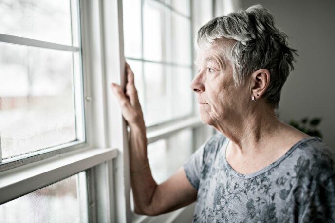 Older Woman Looking Out of Window