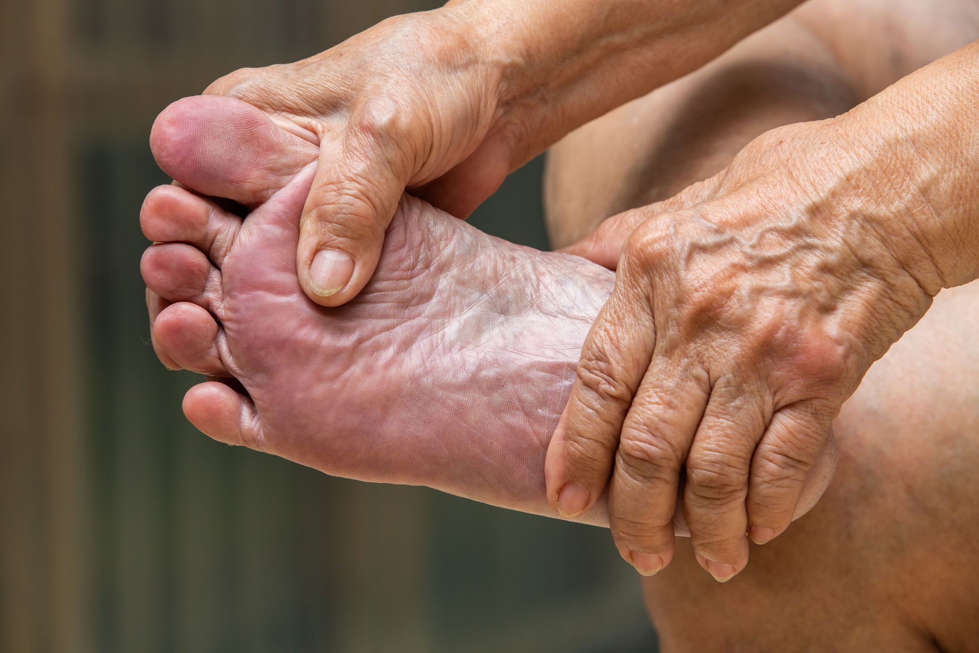 Older Woman Massaging Feet